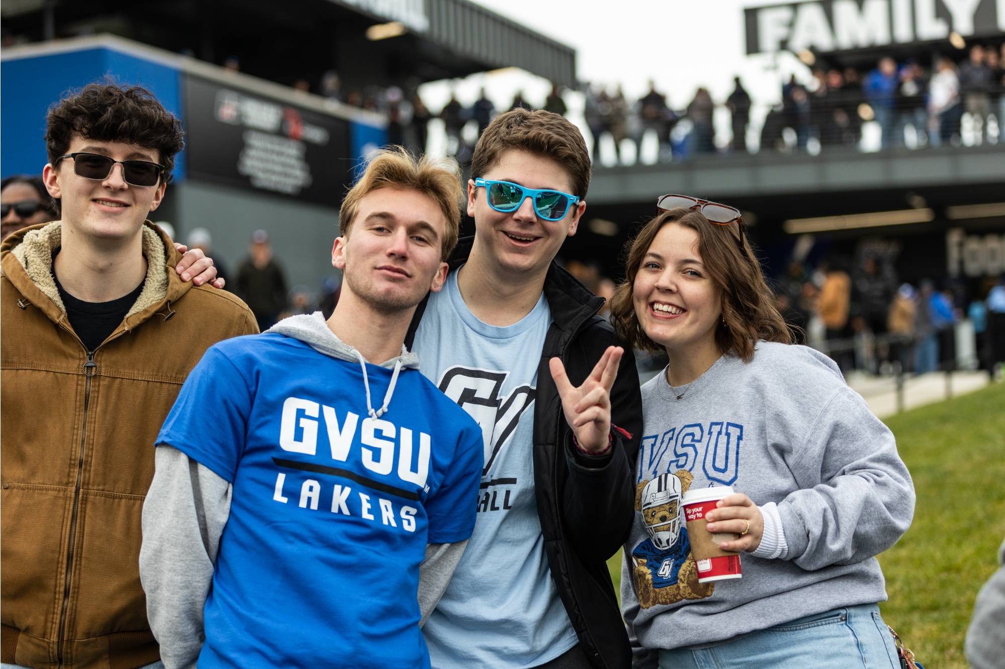 students posing for a photo at a football game